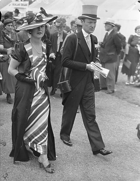 Rainbow fashion at Ascot. Photo shows: Mrs W. J. Connell wearing dazzling rainbow