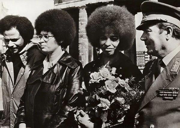On 11 September 1972 the brave American communist and civil rights defender Angela Davis was cordially welcomed by the soldiers of the National Peoples Army of the German Democratic Republic at the Brandenburg Gate (b  /  w photo)