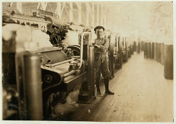 Boy sweeper by carding machines at Lincoln Cotton Mills, Evansville, Indiana in stockinged