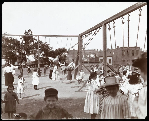 Children swinging at the Hudson Bank Gymnasium and Playground