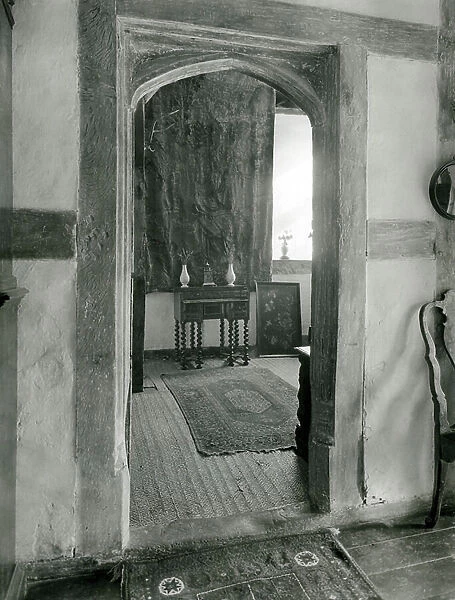 The door from the hall to the original buttery, Beckley Park, Oxfordshire, from The English Manor House (b / w photo)