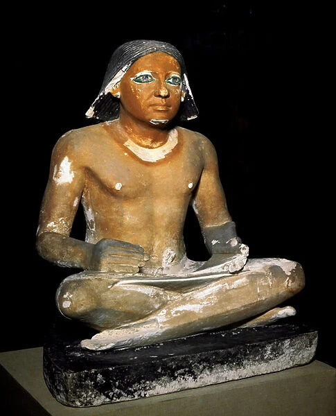 Egyptian antiquite: limestone statue of a sitting scribe from the necropolis of Saqqara