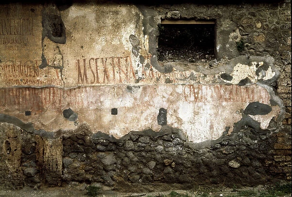 Electoral inscription on the walls (graffiti) on the Via del