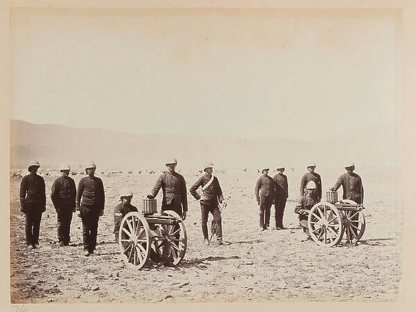A group of soldiers with two Gatling guns, 1879 (b  /  w photo)