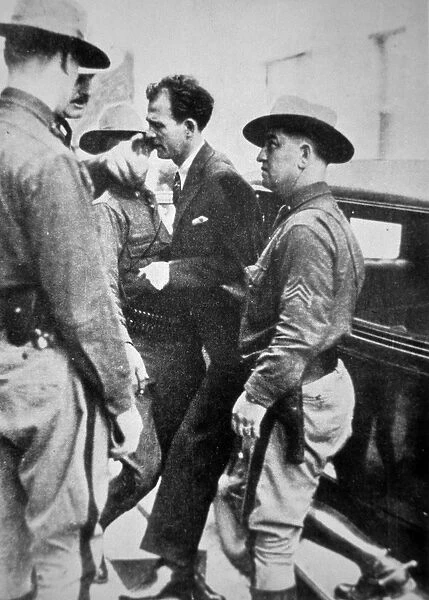 Jack Legs Diamond (1896-1931) being taken into police custody, 1918 (b  /  w photo)