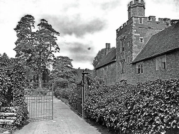 The west front and gatehouse tower from the garden, Ightham Mote, from The English Country House (b / w photo)