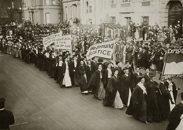 Women in academic dress marching in a suffrage parade in New York City, 1910 (b  /  w photo)