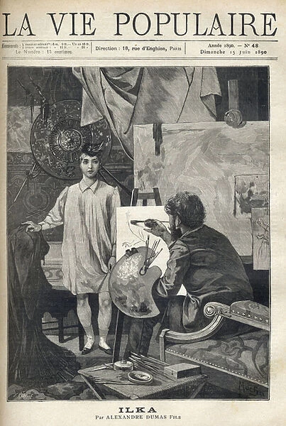 In a workshop, a young model in a shirt and sock wearing a small feather hat