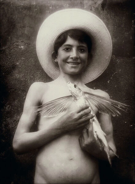 Young boy with flying fish, Sicily, c. 1895 (glass plate)