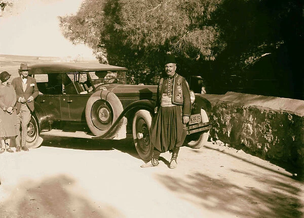 American Consul Oscars Heizer wife beside auto