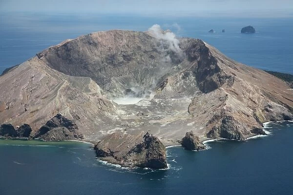 Aerial view of White Island volcano with central acidic crater lake, Bay of Plenty