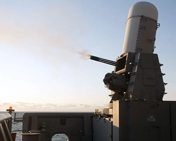 A close-in weapons system fires a burst of tungsten rounds