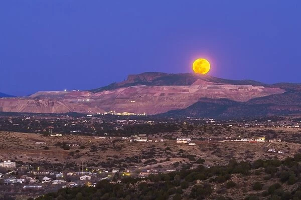 Copper moon rising over the Santa Rita Copper Mine in New Mexico