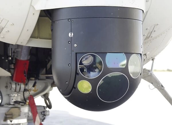 A FLIR camera mounted on an EH101 utility helicopter