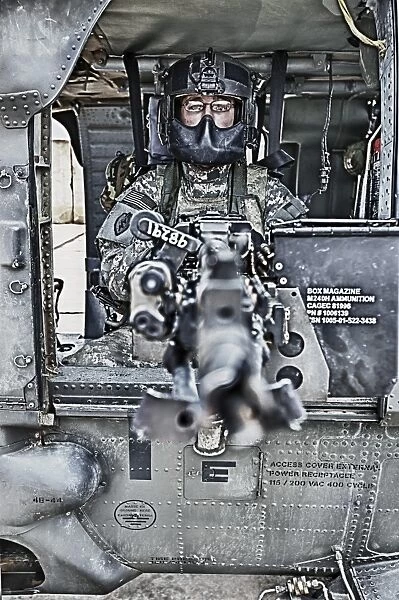 HDR image of a UH-60 Black Hawk door gunner manning a M240 machine gun