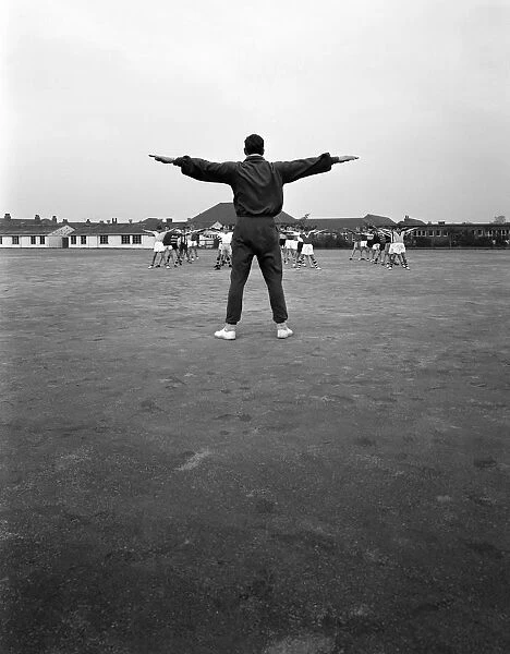 Games master taking a gym class, Airedale school, Castleford, West Yorkshire, 1962