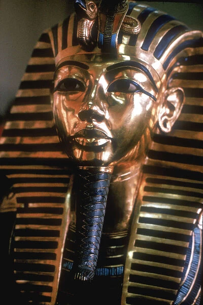 Gold mask of Tutankhamun on his mummy-case
