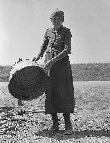 A grandmother in a contractors camp, Stanislaus County, California, 1939. Creator: Dorothea Lange