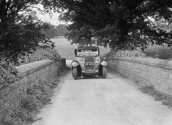 Kitty Brunell road testing a 1931 Delage D8. Artist: Bill Brunell