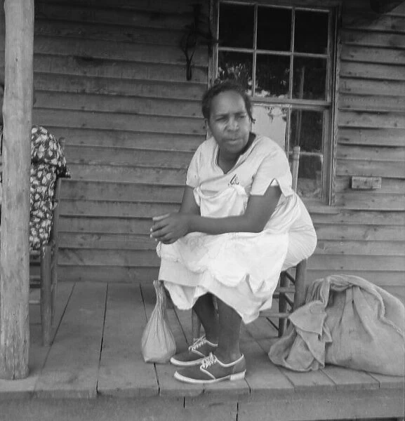 Possibly: Mother of sharecropper family and friend... the rain, Person County, North Carolina, 1939. Creator: Dorothea Lange