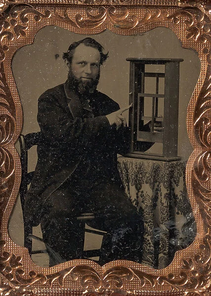 Seated Man Demonstrating Vertical Sliding Window Model, late 1850s-60s. Creator: Unknown