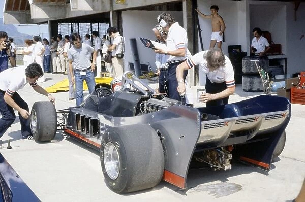 1981 Brazilian Grand Prix: Elio de Angelis in the pits during practice. The Lotus 88 was banned before qualifying