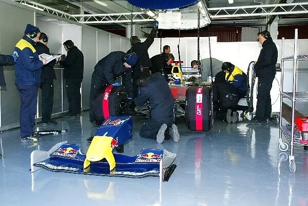 Formula One Testing: Engineers work on the car of David Coulthard Red Bull Racing RB01