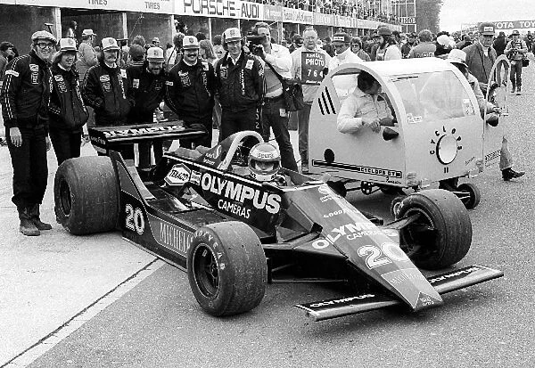 Formula One World Championship: Keke Rosberg Wolf WR7, who crashed out of the race on lap 21, sits in on an impromptu team photograph with a