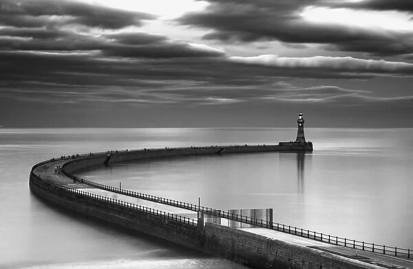 A curving pier with a lighthouse at the end; Sunderland tyne and wear england