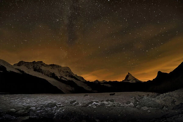 The Matterhorn mountain looms above the Gorner Glacier at night
