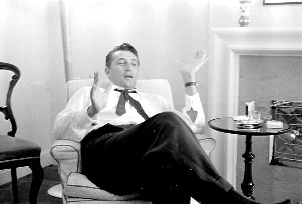 Actor Robert Mitchum during a press interview in London. July 1955