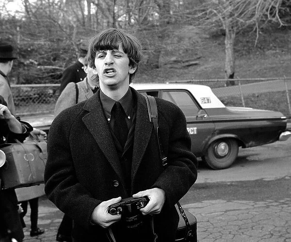 The Beatles February 1964 Ringo Starr holding camera in New York