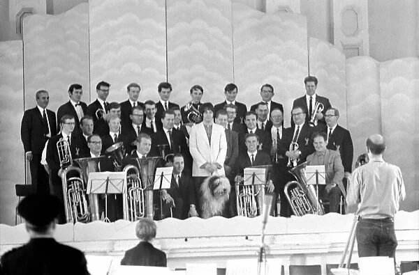 Beatles singer Paul McCartney conducts a brass band. July 1968 Y06397
