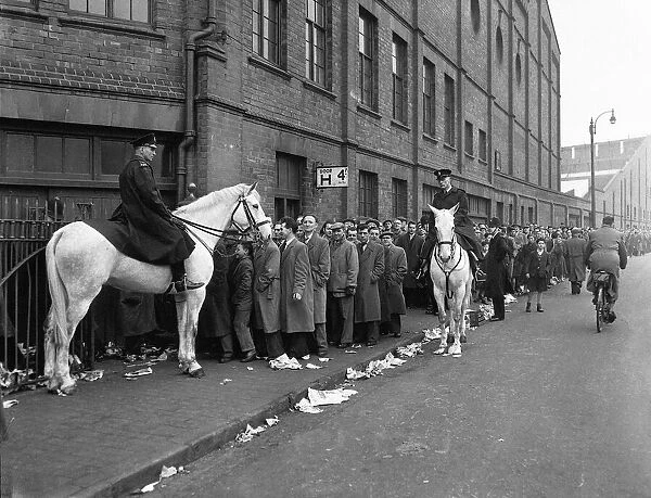 Birmingham City supporters queue for tickets for the FA Cup match against Manchester