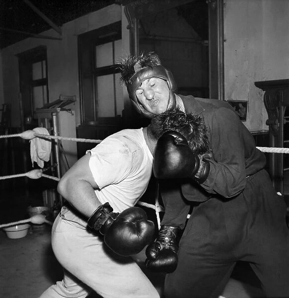 Boxer Don Cockell seen here Training in a Brighton Gym for his next fight his sparring