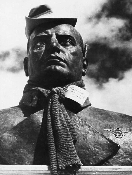 A bust of Mussolini decorated with an Australian hat and scarf. 8th May 1943