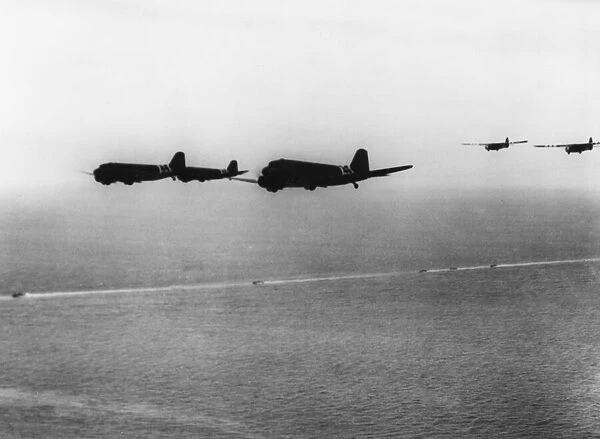 C-47 transport planes. Troop carrying planes of Ninth Air Force towing gliders