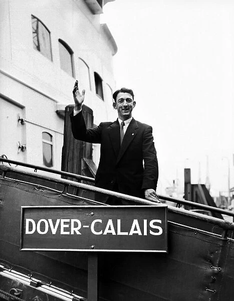 Former Charlton Athletic footballer Eddie Firmani waves goodbye as he boards his ship at