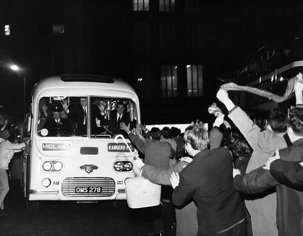 Cheering fans greet victorious Rangers players bus in St Enoch Square after FA Cup Final