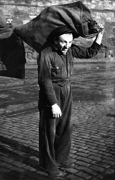 Coalman Robert Scott humping bags of coal for a living