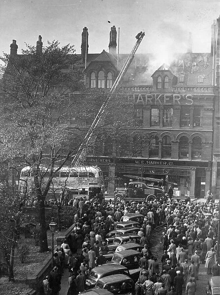 Crowds of spectators watch the fire at W E Harkers Furniture shop in Grainger Street