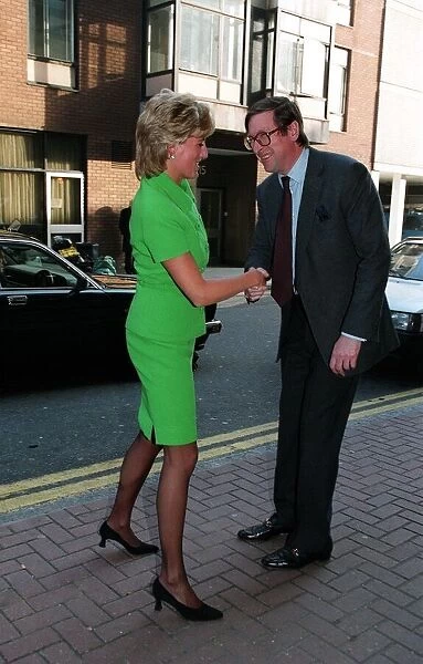 Diana, Princess of Wales is greeted by Max Hastings, Editor of the Evening Standard