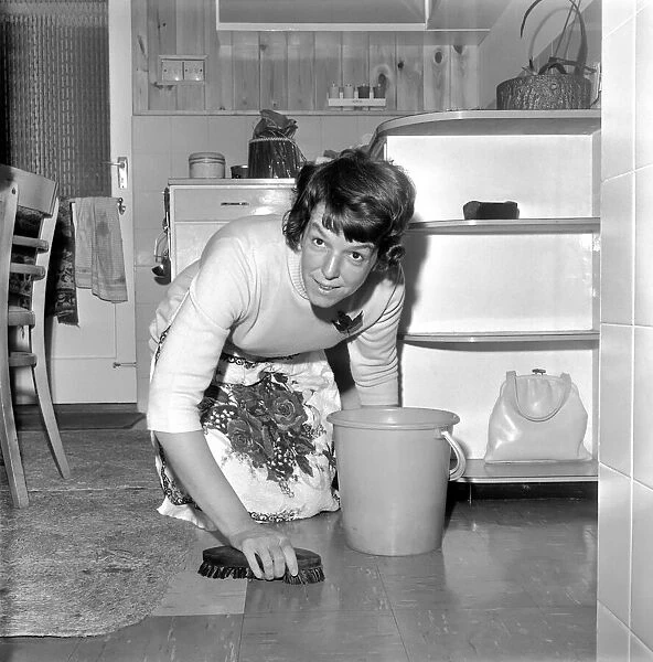 Domestic Life: Washing and cleaning a house wifes work is never done. February 1969