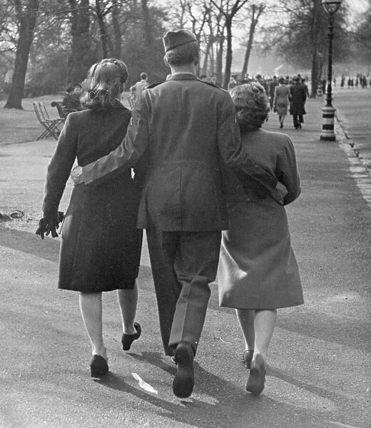 Easter Parade in Hyde Park, April 9th 1944. OPS A soldier with a woman on each arm