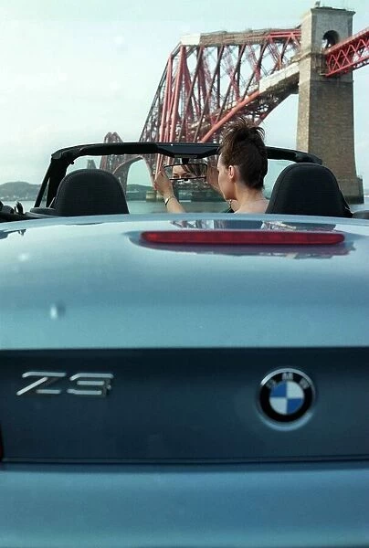 Eileen Catterson and BMW Z3 convertible car May 1998 at Forth Rail Bridge