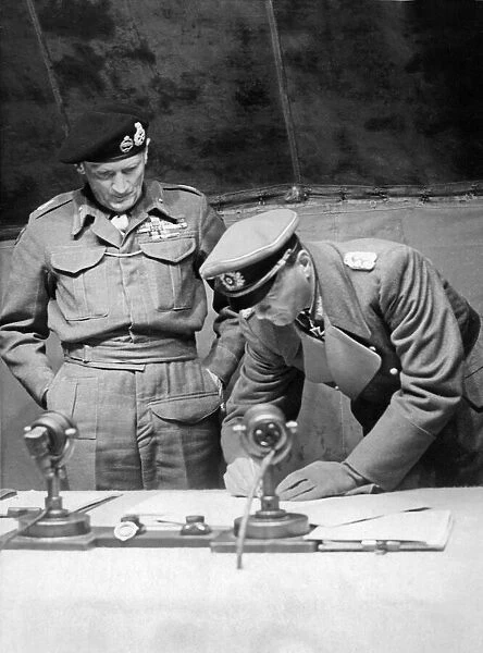 Field Marshal Bernard Montgomery watches General Kienzl the Chief of Staff to German