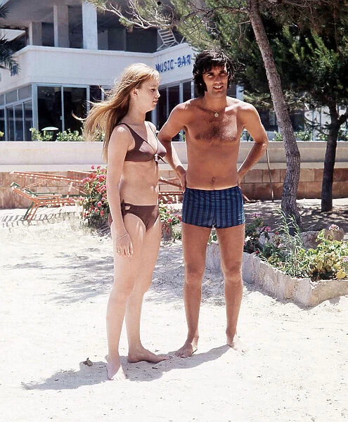 George Best football player and Susan George actress on holiday in Palma Nova Majorca