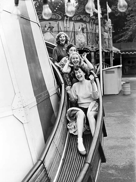 A group of friends enjoying Battersea Fun Fair, London. 14th June 1953