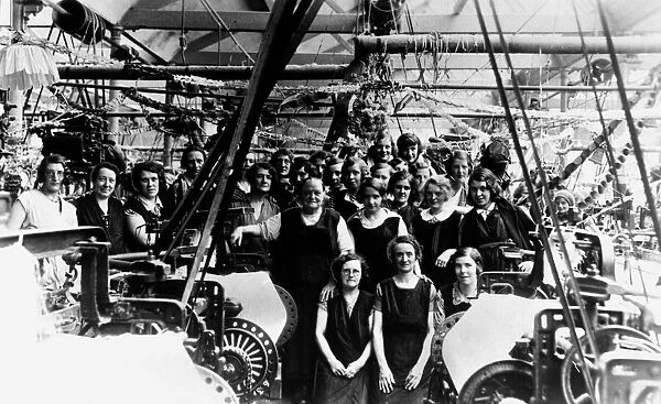 A group of weavers pose for a photograph at India Cotton Mill in Blackbirn, Circa 1930