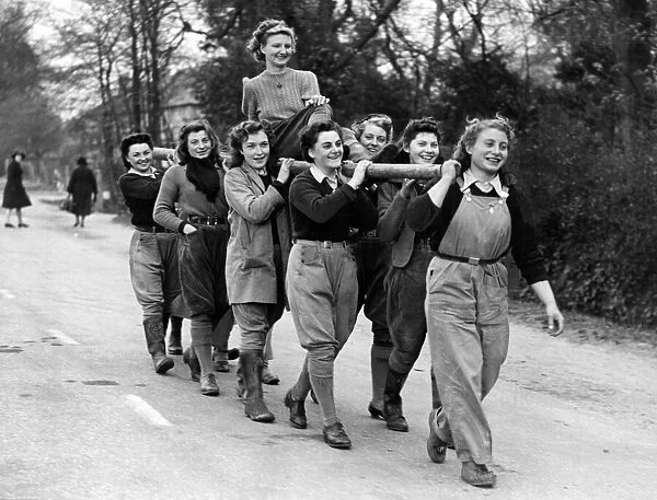 Iris Richardson being carried by her colleagues in the Land Army at the YWCA hostel